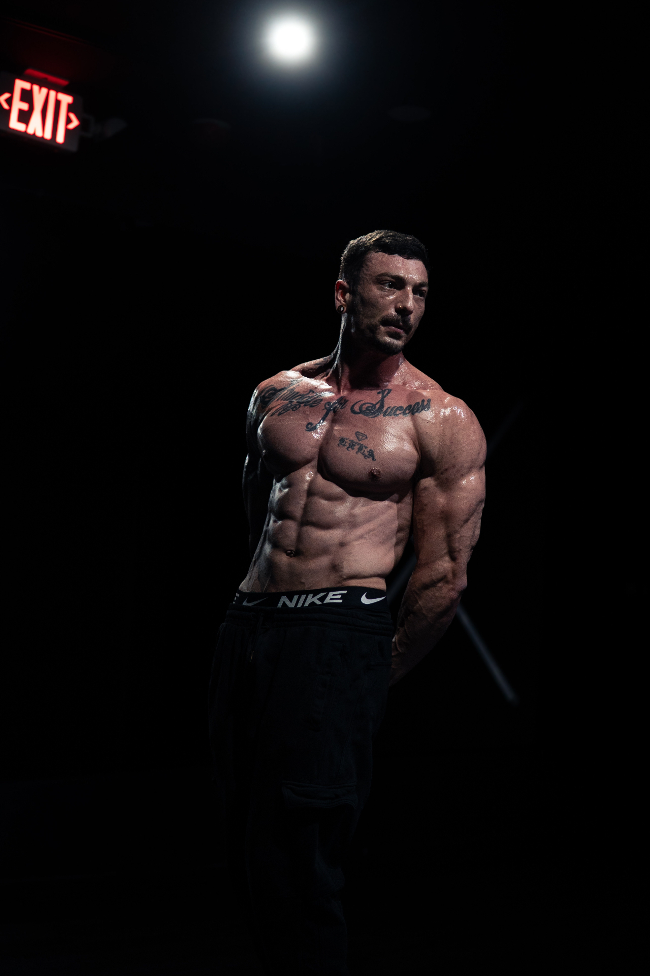 Nick Antap displaying his stage-ready physique under competition lighting